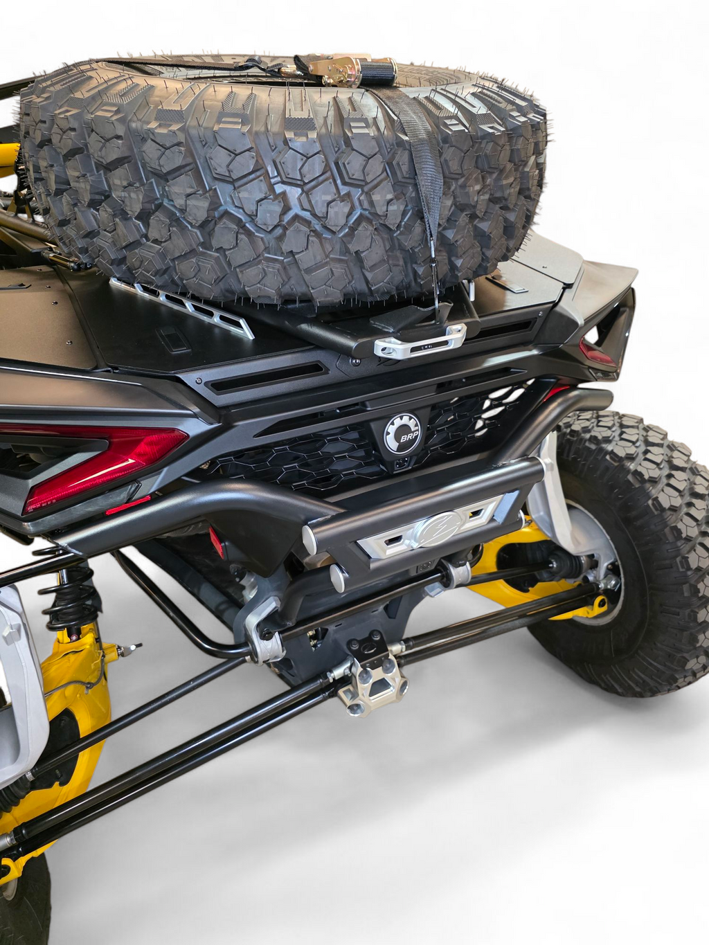 Can-Am Maverick R AMP Rear Bumper shown with Baja Box and tire rack installed, demonstrating seamless fit of the full rear setup
