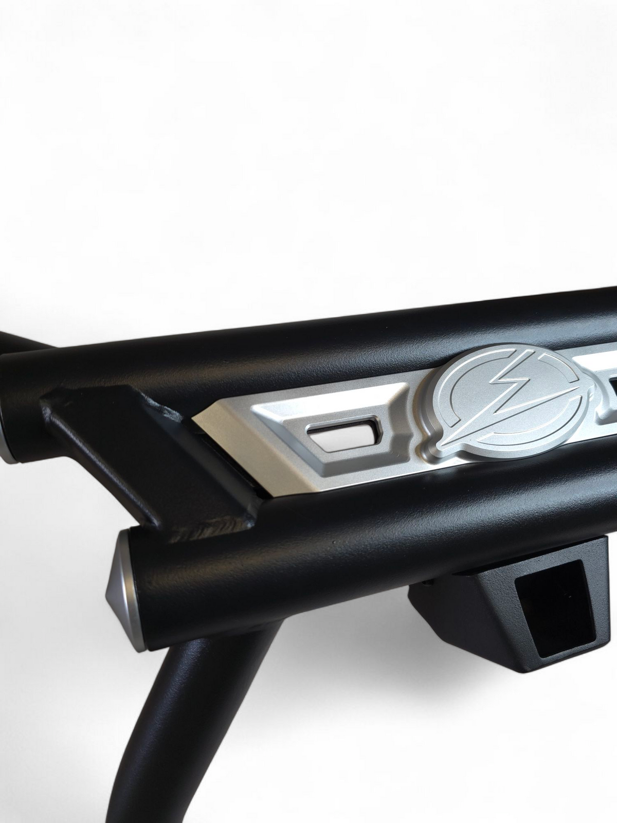 AMP Rear Bumper on Can-Am Maverick R shown with Volt Tire Carrier mounted, demonstrating seamless compatibility
