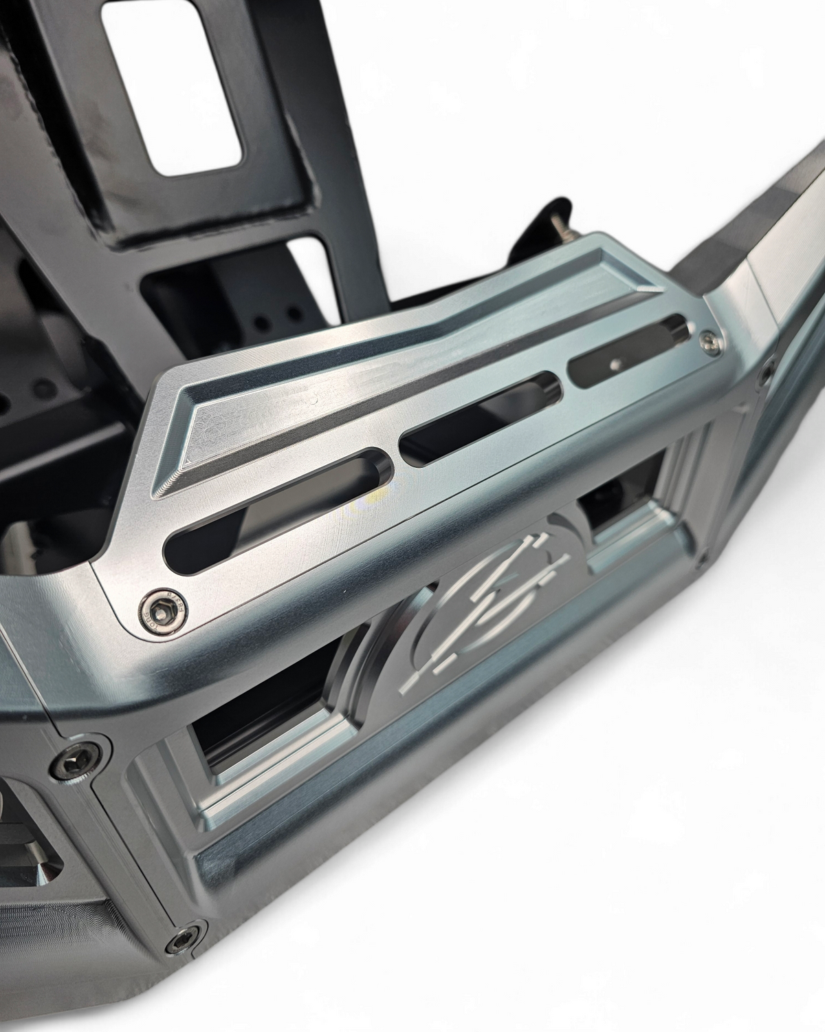 Hidden steel winch mount detail on Can-Am Maverick X3 billet front bumper showing frame-attached construction

