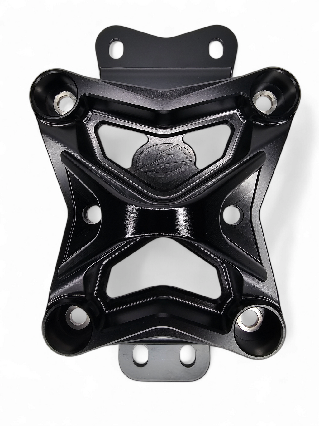 Black anodized 10-bolt radius rod plate installed on Can-Am Maverick X3 protecting rear suspension heim joints